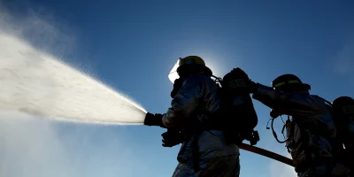 Firefighters trying to put out a fire Firefighters trying to put out a fire